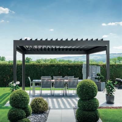 Garden with pergola and dining table in the shade